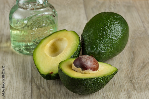 Two fresh ripe raw hass avocados, close up, healthy food concept. On a table of gray boards.