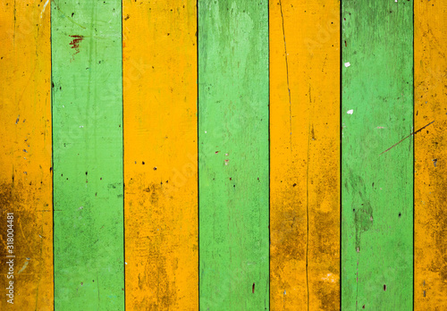Yellow and green colored wood walls © Noppadol