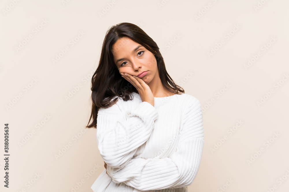 Young brunette woman with white sweater over isolated background unhappy and frustrated Young brunette woman with white sweater over isolated background unhappy and frustrated