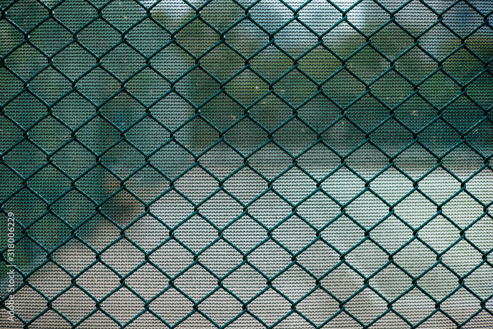 Fototapeta premium Close-up chain link fence , Sunset background