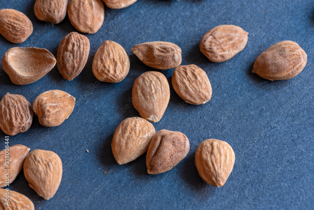 shelled almonds on a slate board shelled almonds on a slate board
