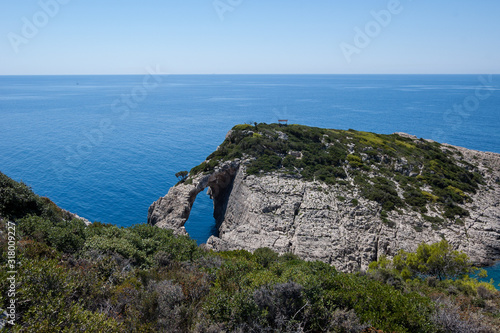 Rocky beach seashore on Zakynthos with cliffs