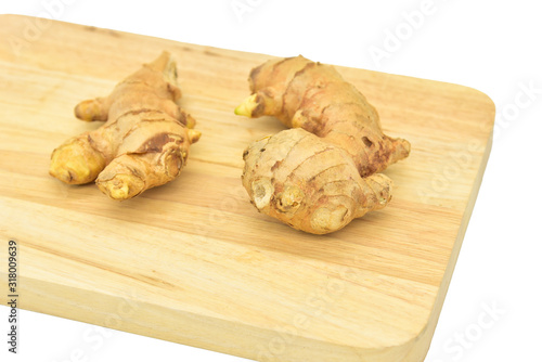 Fresh Gingers on Wooden Board