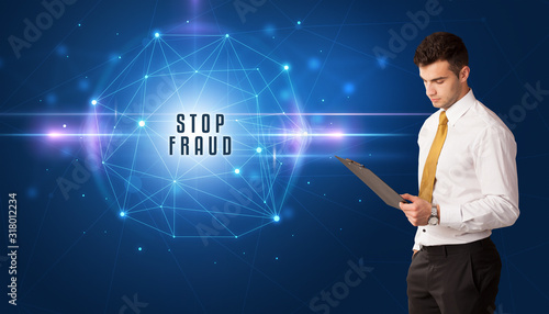 Businessman thinking about security solutions with STOP FRAUD inscription