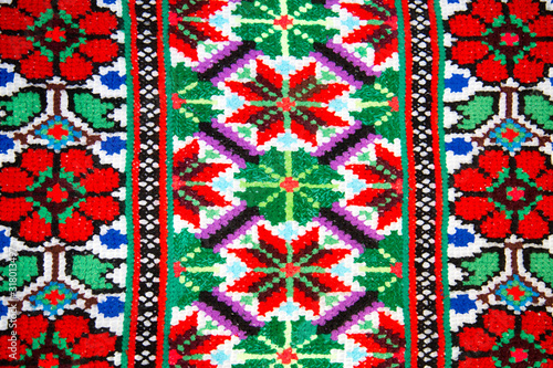 Slavic traditional national ornament on fabrics and towels, cross-stitch. Interior, background, structure.