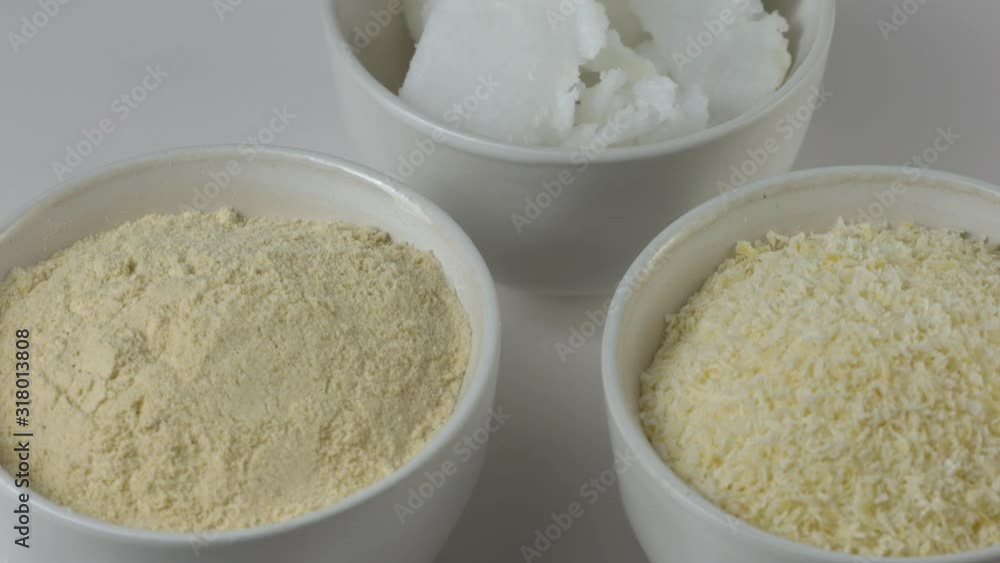 Coconut Products - coconut butter, flakes and flour on white background. Coconut Products - coconut butter, flakes and flour on white background.