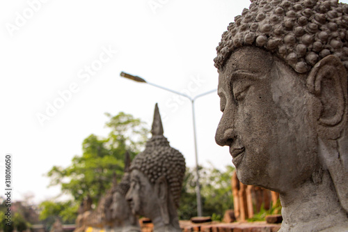 Statues of Buddhist monks in the ancient city of Ayutthaya, Thailand. photo