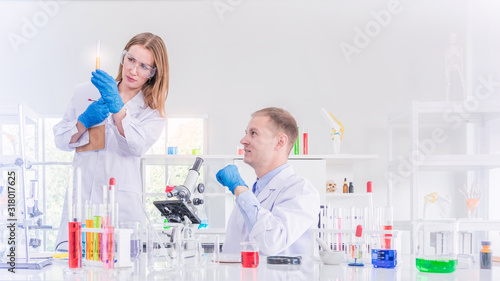 Two scientists working in chemical laboratory