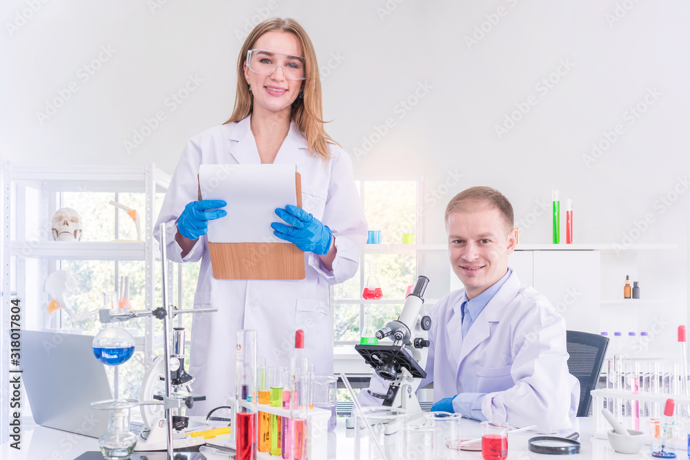 Two scientists working in chemical laboratory Two scientists working in chemical laboratory