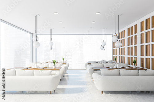 Panoramic cafe interior with white sofas