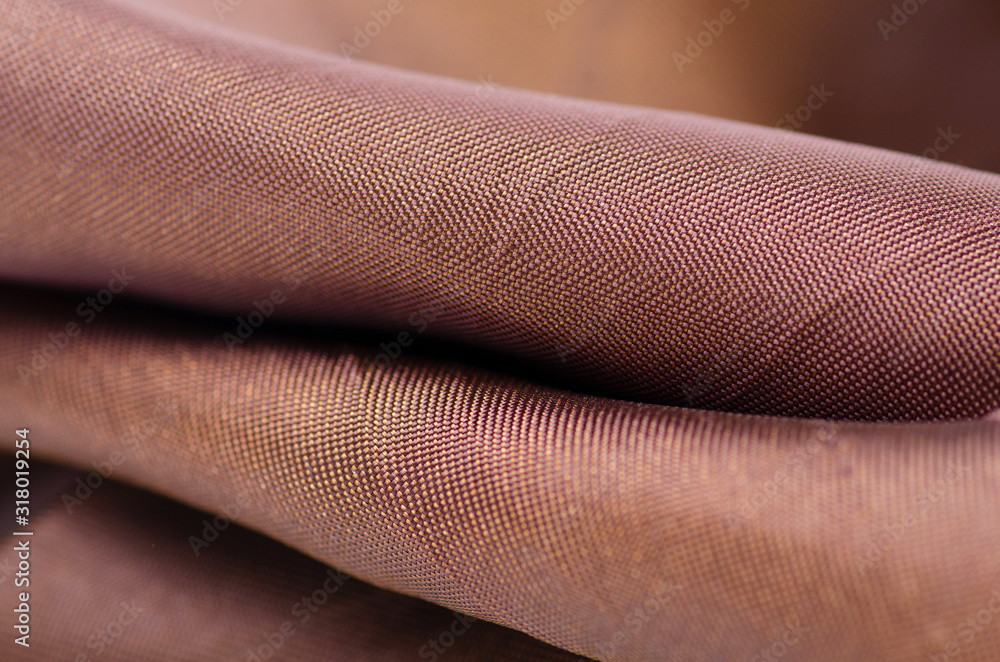 Gold bronze fabric material macro blur background Gold bronze fabric material macro blur background