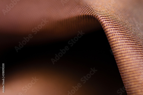 Gold bronze fabric material macro blur background