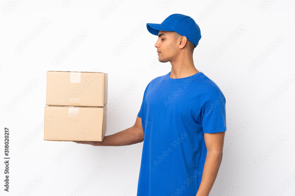 Delivery man over isolated white background with happy expression Delivery man over isolated white background with happy expression