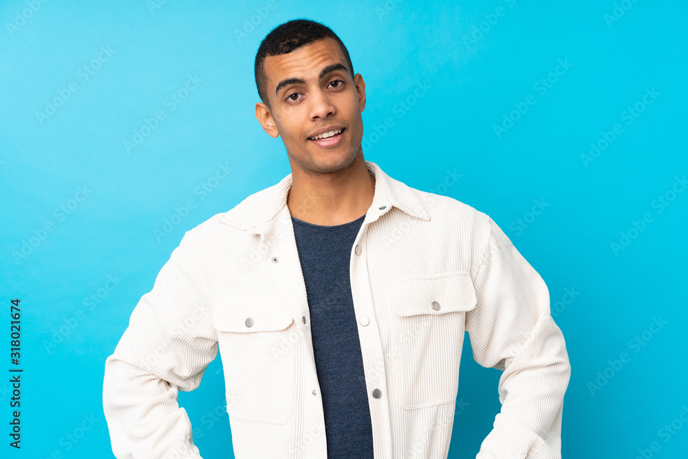 Young African American man over isolated blue background laughing Young African American man over isolated blue background laughing