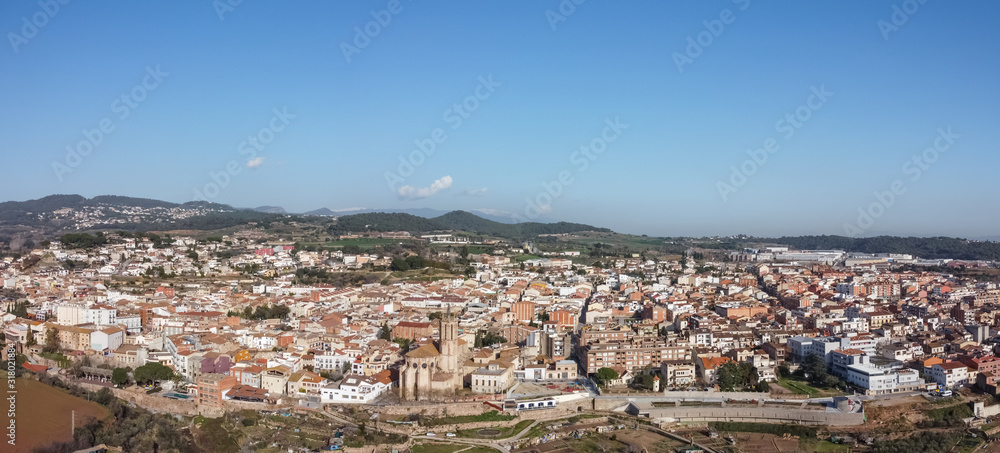 Aerial view of Caldes de Montbui and its church Santa Maria. Medieval roman village in Catalonia, Spain.