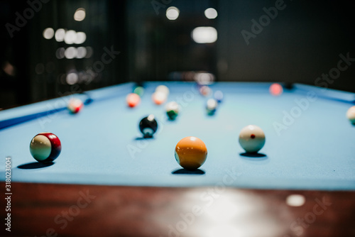  Pool balls on a blue pool table 