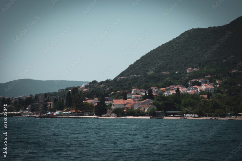 Fragment of the Bay of Kotor with houses on shore, Montenegro. Vintage toning and Blur background