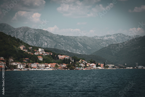 Fragment of the Bay of Kotor with houses on shore, Montenegro. Vintage toning © olgavolodina