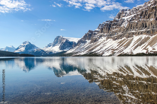 Bow Lake in early spring season with some snow left, perfect reflection, Banff National Park, Canada