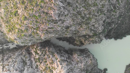 Aerial view of Isbert reservoir in Barranc de l'Infern (The Hell's Ravine), La Vall de Laguar, Spain. The dam is overflown. photo