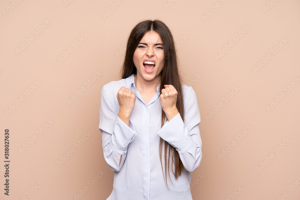 Young woman over isolated background frustrated by a bad situation Young woman over isolated background frustrated by a bad situation