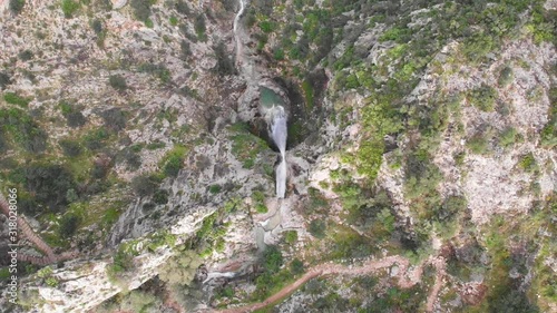 Aerial view of a big waterfall in Barranc de l'Infern, the Hell's Ravine, after a heavy rain in La Vall de Laguar, Spain. photo