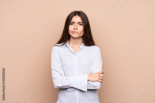 Young woman over isolated background feeling upset