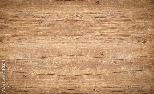 Wood texture background., vintage wooden table with cracks and knotts. Light brown surface of old wood with natural color and pattern. photo