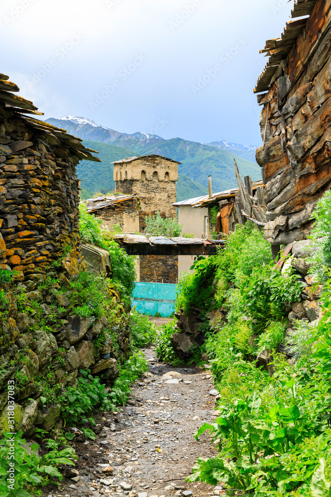 View of the Ushguli village at the foot of Mt. Shkhara. Picturesque and gorgeous scene. Rock tower towers and old houses in Ushguli