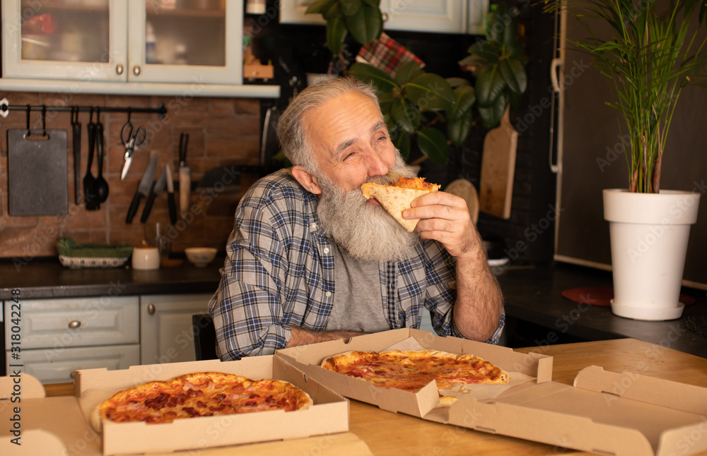 Close-up view of happy bearded senior man eating pizza Close-up view of happy bearded senior man eating pizza