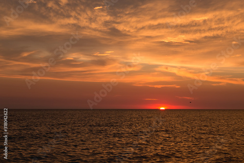 Seascape. The sun peeked over the horizon. © Amir