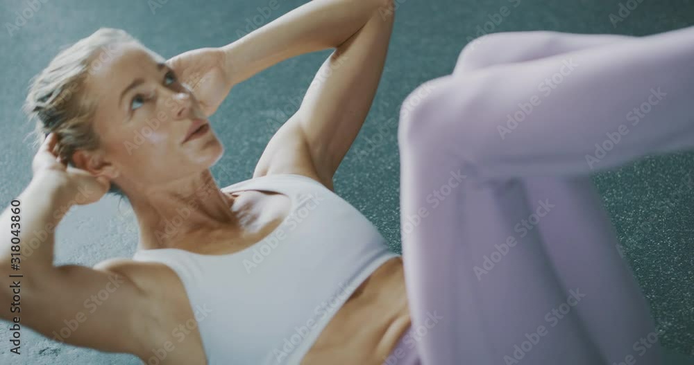 Fit woman doing crunch exercises Fit woman doing crunch exercises