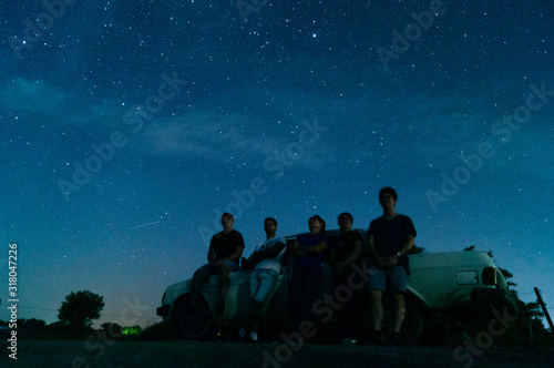 people on the background of the starry sky