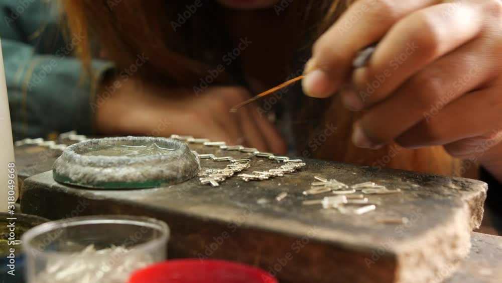 Woman Making Traditional Burmese Silver Necklace. Silversmiths Floating Village On Inle lake. 4K Close Up Footage. Myanmar. Woman Making Traditional Burmese Silver Necklace. Silversmiths Floating Village On Inle lake. 4K Close Up Footage. Myanmar.