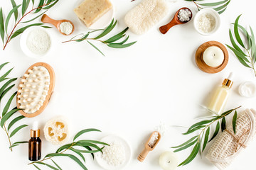 Spa concept with eucalyptus oil and eucalyptus leaf extract natural /organic spa cosmetics products, eco friendly bathroom accessories. Skincare concept on white background. Flat lay composition top v