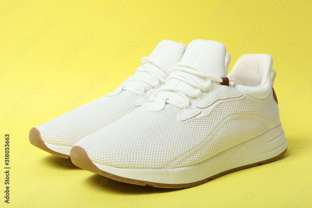 men's sneakers on a colored background. men's footwear. minimalism men's sneakers on a colored background. men's footwear. minimalism