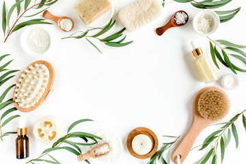 Spa concept with eucalyptus oil and eucalyptus leaf extract natural /organic spa cosmetics products, eco friendly bathroom accessories. Skincare concept on white background. Flat lay composition top v