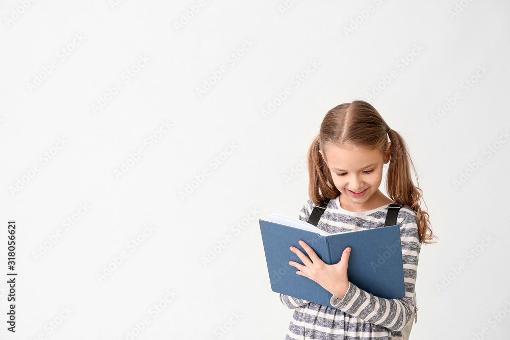 Cute little girl with notebook on white background Cute little girl with notebook on white background