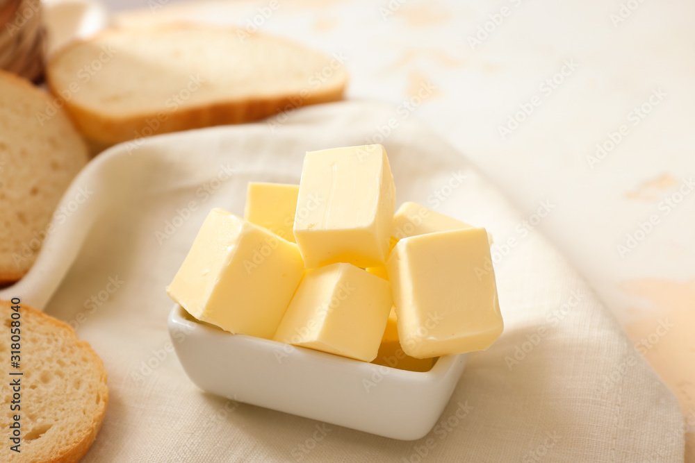 Bowl with fresh butter on table Bowl with fresh butter on table