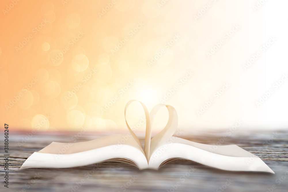 Close up heart shape from paper book on pink bokeh background,valentines day concept Close up heart shape from paper book on pink bokeh background,valentines day concept