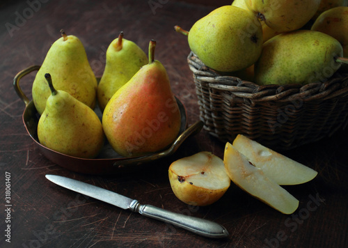 Ripe, juicy green pears in a bowl. Pears on the table