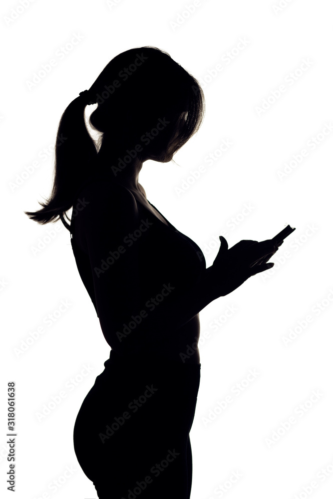 silhouette figure sporty girl on white isolated background phoneb woman counts calories on smartphone, healthy lifestyle concept