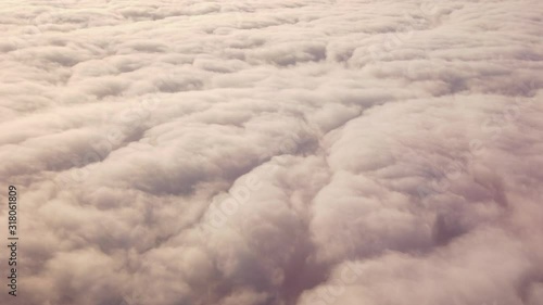 Aerial view above fluffy soft white clouds