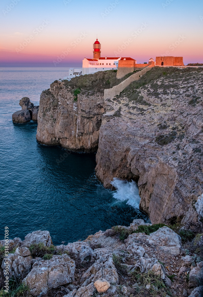 Sagres, Portugal - beautiful sunrise colors over lighthouse on Atlantic coast 