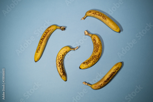 Five Ripe Bananas on Blue