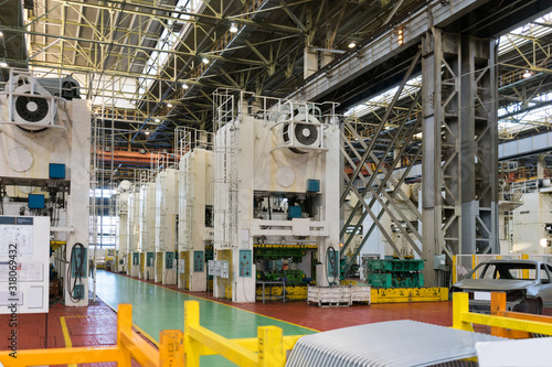 Production of car bodies on stamping presses.