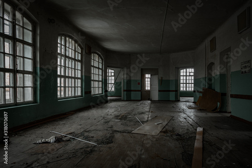 Inside old Orlovka Asylum for the insane in Voronezh Region. Dark creepy abandoned mental hospital photo