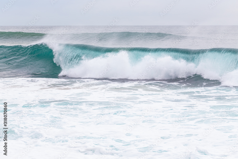 Ocean coast, moviment waves with foam.