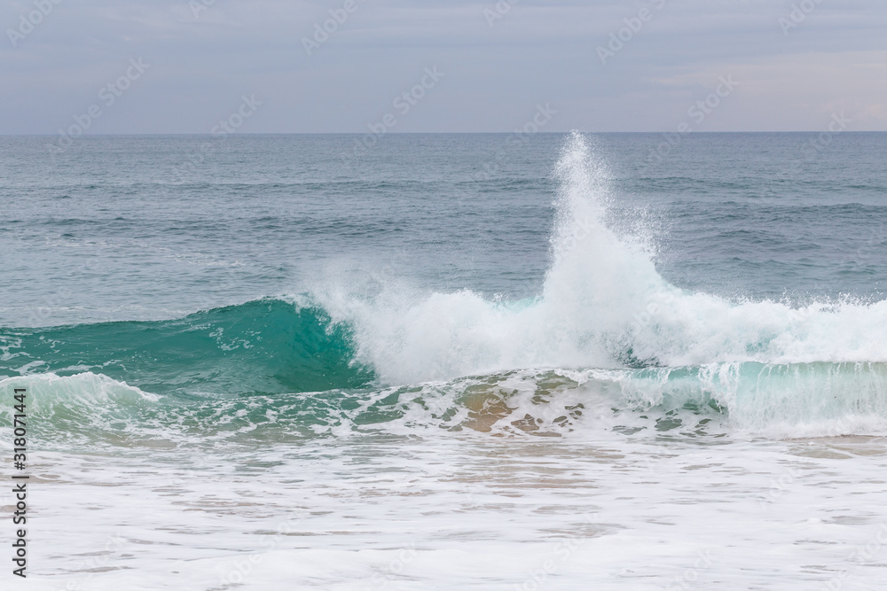 Ocean coast, moviment waves with foam.