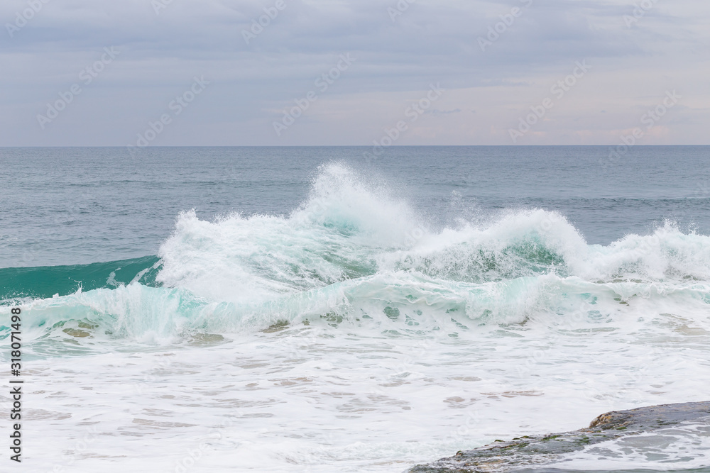 Fototapeta premium Ocean coast, moviment waves with foam.